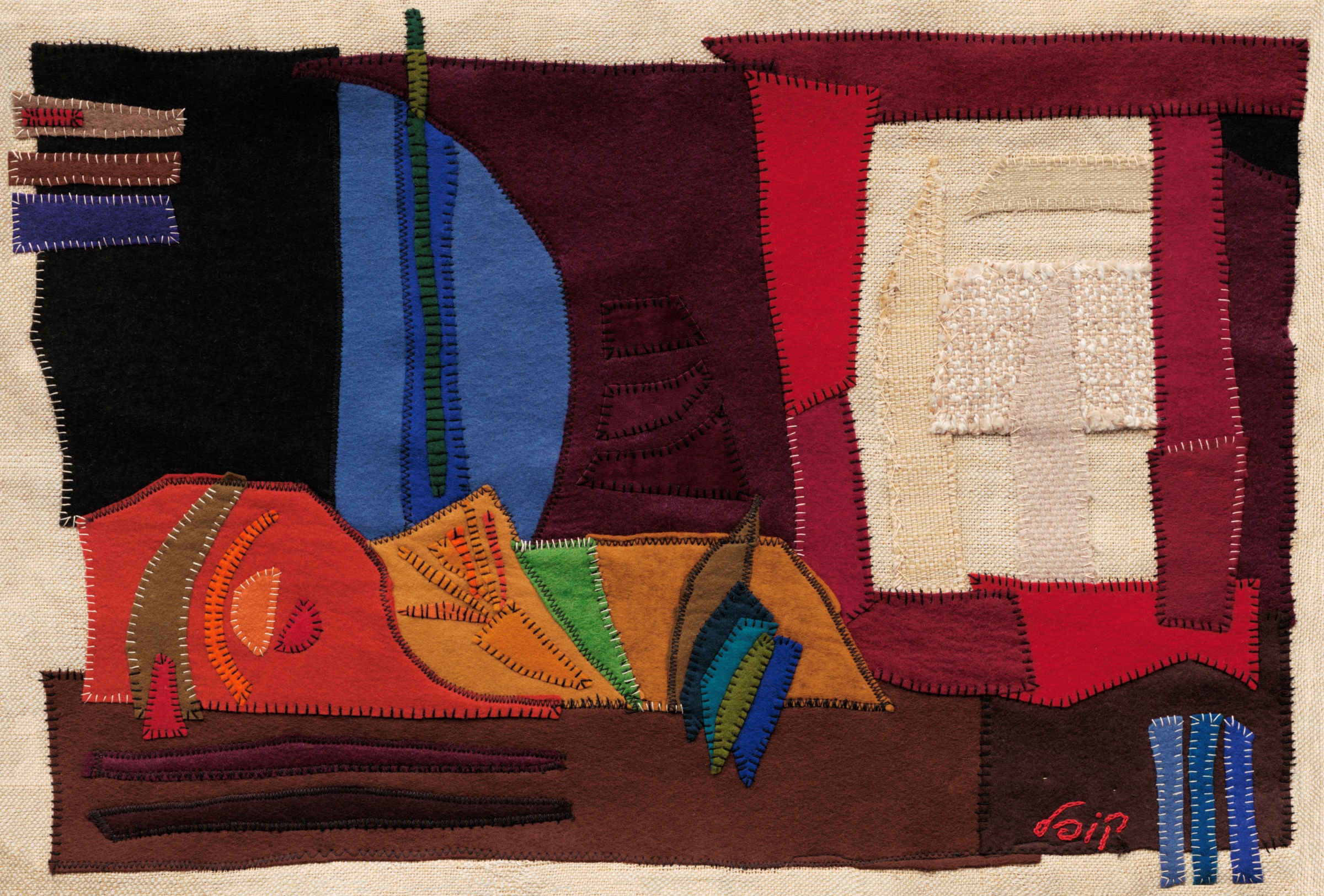 A Boat by Kopel Gurwin, an abstract hand-cut felt appliqué featuring overlapping geometric and curved shapes in burgundy, red, orange, blue, green, and brown. A pale textured rectangular panel occupies the upper right, while elongated horizontal forms suggest the structure of a boat against a natural beige fabric background.