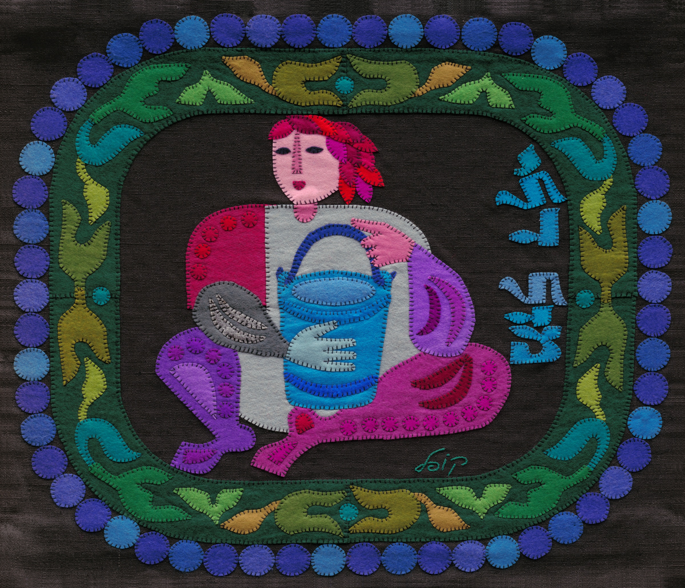 Aquarius by Kopel Gurwin, a hand-cut felt appliqué depicting a stylized water-bearer seated within an ornamental circular frame. The figure holds a bright blue vessel, while blue Hebrew lettering at the right identifies the sign as Mazal Dli. The composition is rendered in vivid pinks, purples, greens, and blues against a dark ground.